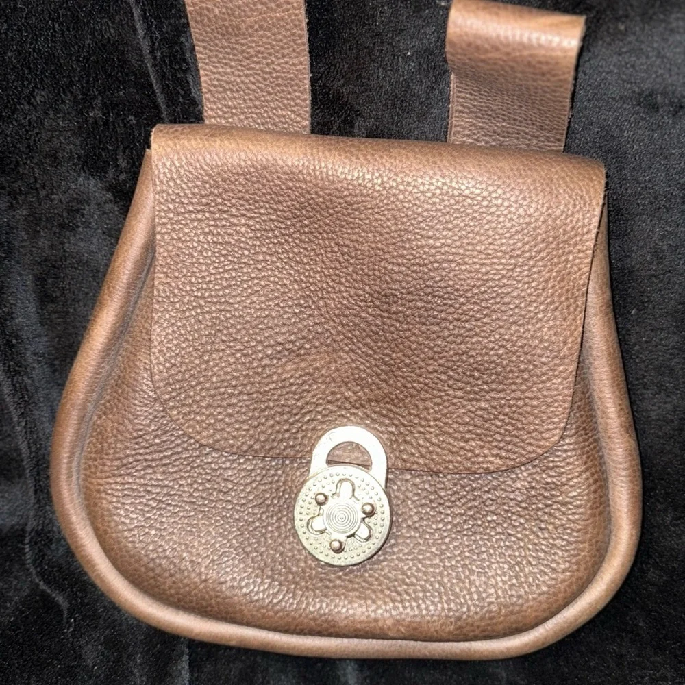 Brown Leather Backpack with Classic Design and Flap Closure